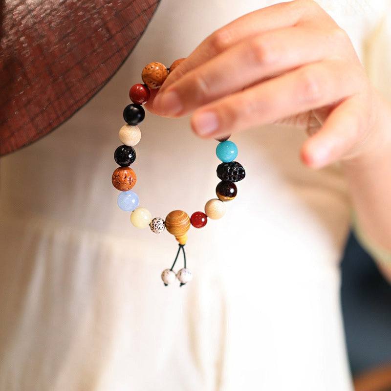 Multicolour Beads Bracelets featuring handmade round beads in varied colours with dangling cord and charms