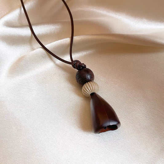 Long Necklace With A Brown Geometric Beaded Pendant